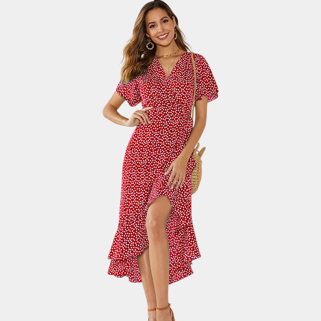 Dames wikkeljurk met V-hals, speelse print en asymmetrische rok – perfect voor zomer, strand en tuinfeest