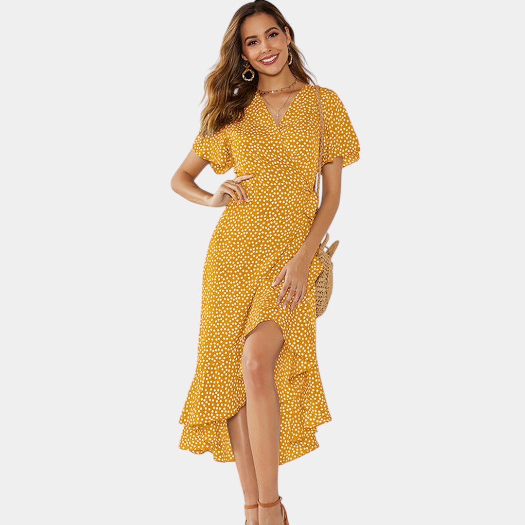 Dames wikkeljurk met V-hals, speelse print en asymmetrische rok – perfect voor zomer, strand en tuinfeest