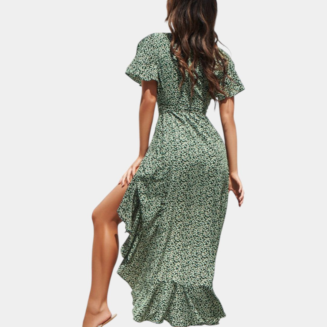 Dames wikkeljurk met V-hals, speelse print en asymmetrische rok – perfect voor zomer, strand en tuinfeest
