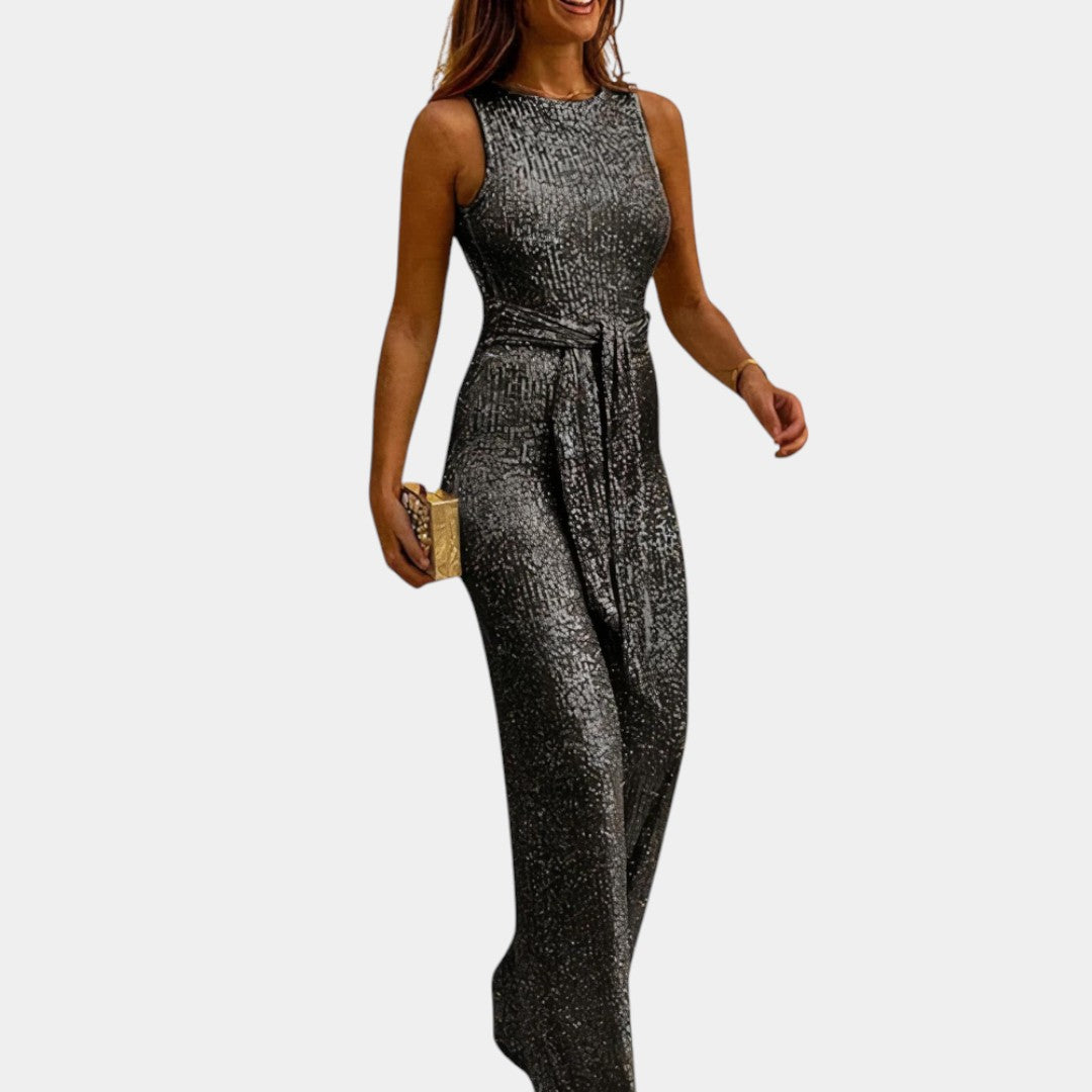 Dames glitter jumpsuit met flatterende pasvorm en glanzend design, perfect voor bruiloften, gala’s en feestelijke avonden.