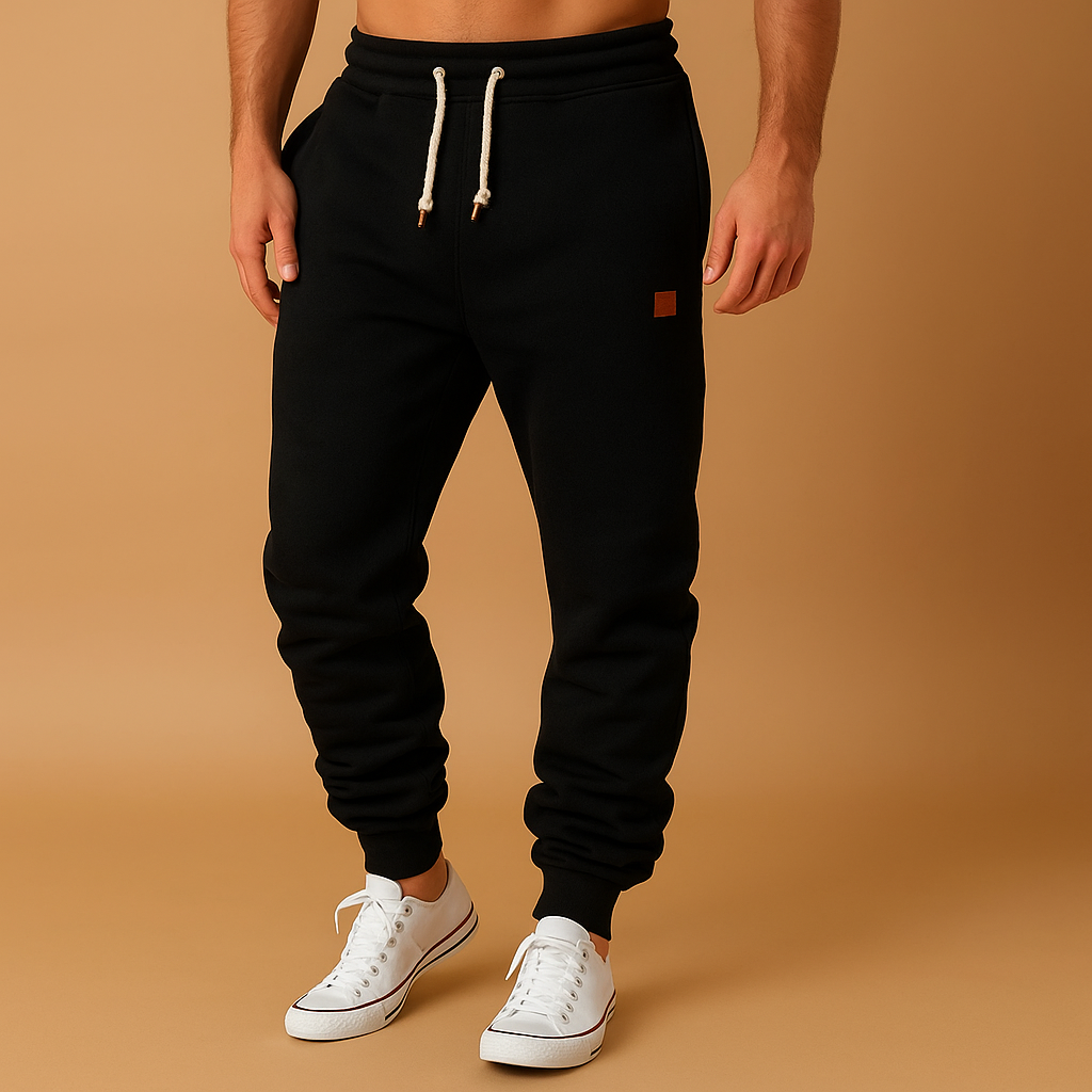 Comfortabele joggingbroek voor heren van katoenmix met verstelbare tailleband en zijzakken, perfect voor sport of ontspanning.