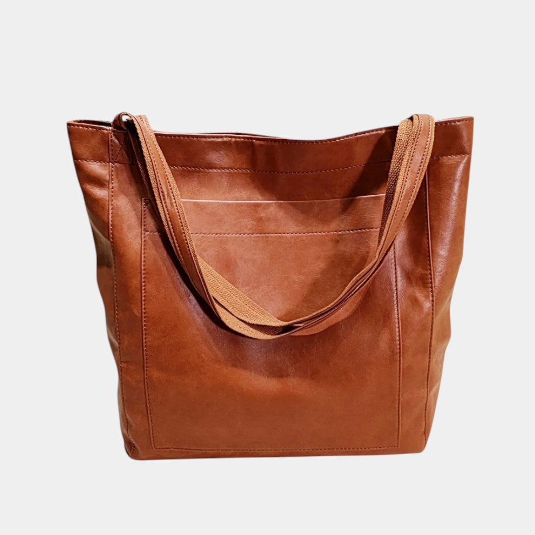 Handgemaakte schoudertas van kunstleer voor dames, met elegant design en ruime opbergruimte – ideaal voor dagelijks gebruik of formele gelegenheden.