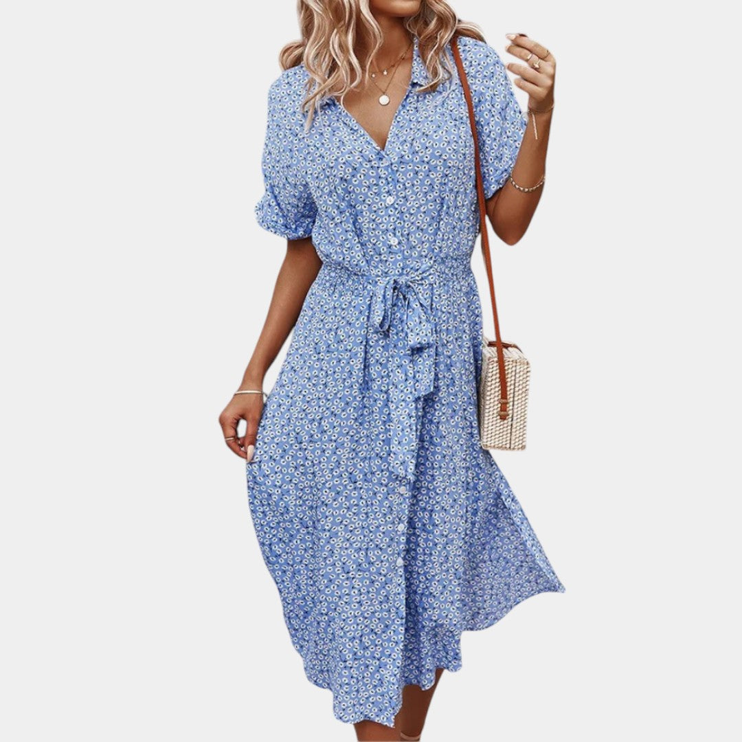 Dames midi-jurk met bloemenprint, korte mouwen en flatterende pasvorm, ideaal voor zomerse dagen en casual gelegenheden.