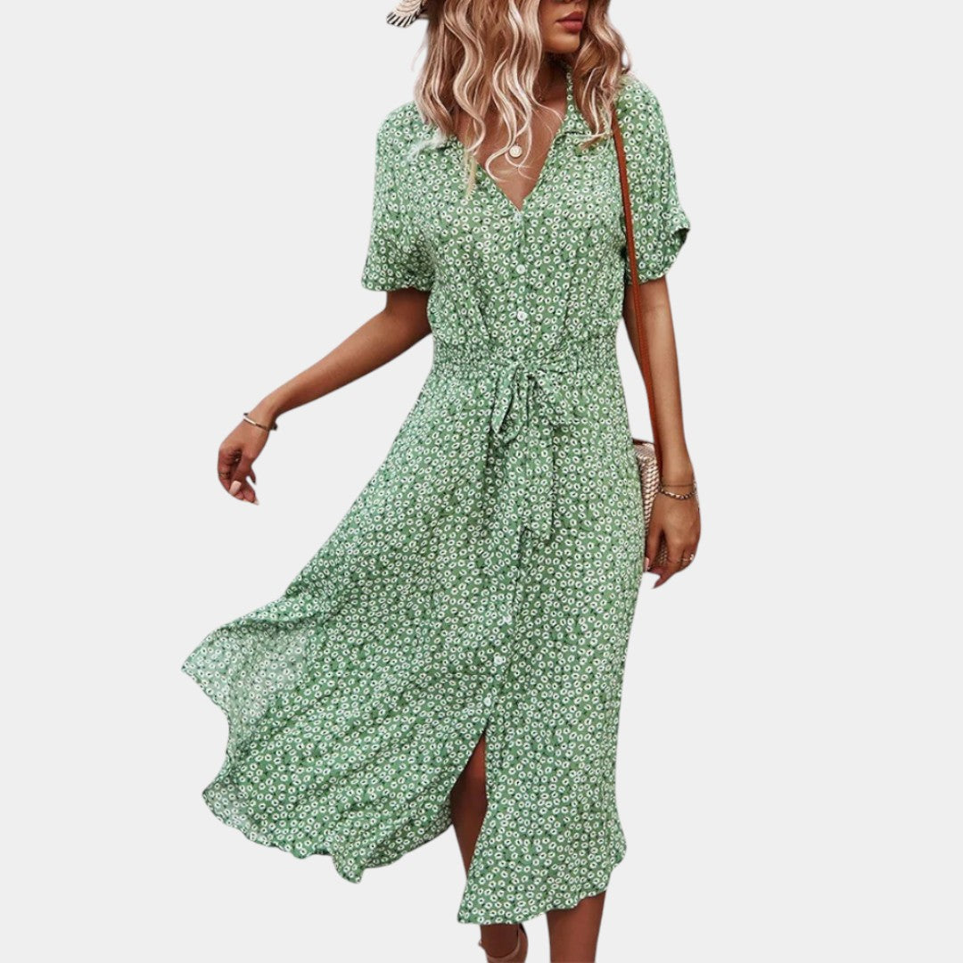 Dames midi-jurk met bloemenprint, korte mouwen en flatterende pasvorm, ideaal voor zomerse dagen en casual gelegenheden.
