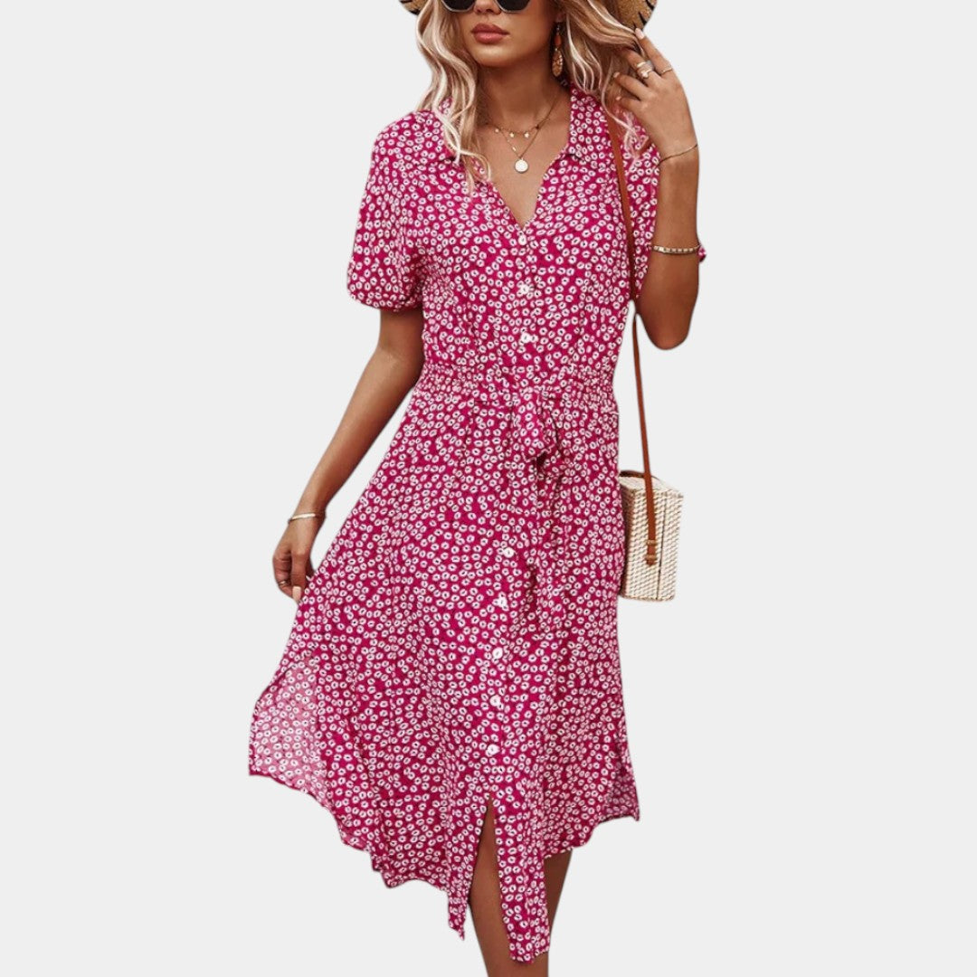 Dames midi-jurk met bloemenprint, korte mouwen en flatterende pasvorm, ideaal voor zomerse dagen en casual gelegenheden.