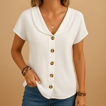 Elegante damesblouse met klassieke kraag, knoopsluiting en ademende pasvorm, ideaal voor werk of casual outfits.