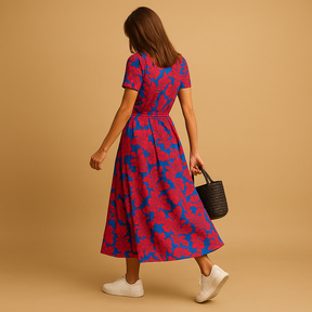 Elegante dames zomerjurk met A-lijn pasvorm, pofmouwen en knoopdetails – ideaal voor casual en stijlvolle zomerdagen