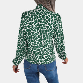 Dames blouse met stippenpatroon, strikdetail en elastische manchetten, geschikt voor zowel zakelijke als casual outfits