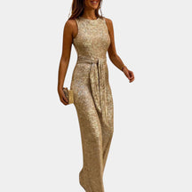 Dames glitter jumpsuit met flatterende pasvorm en glanzend design, perfect voor bruiloften, gala’s en feestelijke avonden.