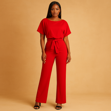 Dames jumpsuit met halternek, open rug en glitterstof – ideaal voor feestjes, gala’s en elegante gelegenheden.