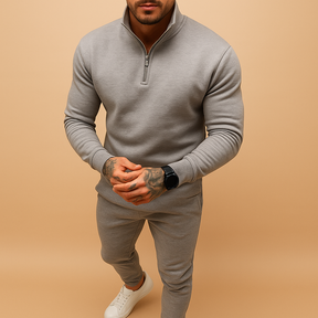 Joggingpak voor heren met halve rits trui en joggingbroek, beschikbaar in zwart, grijs, wit en khaki – ideaal voor thuis of onderweg.