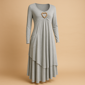 Elegante lange damesjurk met O-hals, lange mouwen en praktische zakken, geschikt voor dagelijks en formeel gebruik