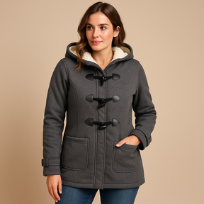 Lange winterjas met capuchon voor dames, windbestendig met moderne snit. Comfortabel en elegant, ideaal voor koude dagen en avondwandelingen.
