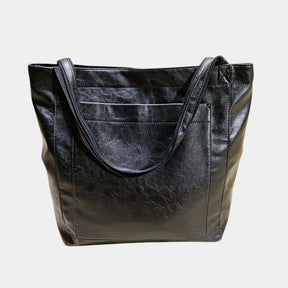 Handgemaakte schoudertas van kunstleer voor dames, met elegant design en ruime opbergruimte – ideaal voor dagelijks gebruik of formele gelegenheden.
