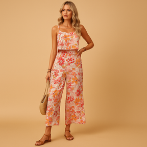 Zomerse dames jumpsuit zonder mouwen met roze bloemenprint en vierkante halslijn, ideaal voor warme dagen en casual of feestelijke gelegenheden.