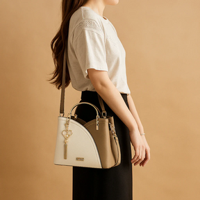 Schoudertas voor dames met geometrisch patroon, metalen accenten en verstelbare draagoptie, geschikt voor dagelijks en formeel gebruik.