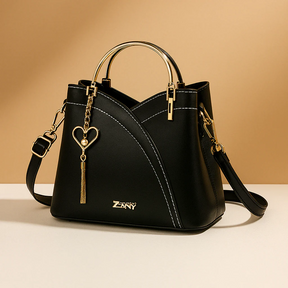 Schoudertas voor dames met geometrisch patroon, metalen accenten en verstelbare draagoptie, geschikt voor dagelijks en formeel gebruik.