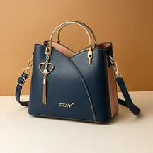 Schoudertas voor dames met geometrisch patroon, metalen accenten en verstelbare draagoptie, geschikt voor dagelijks en formeel gebruik.