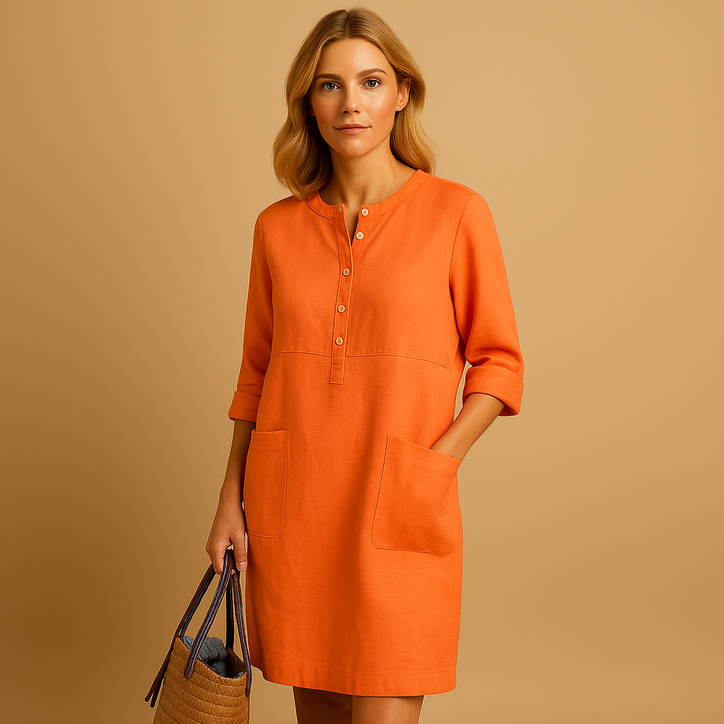 Casual dames tuniekjurk met knopen, zakken en opgerolde mouwen – ideaal voor dagelijks comfort en ontspannen stijl.