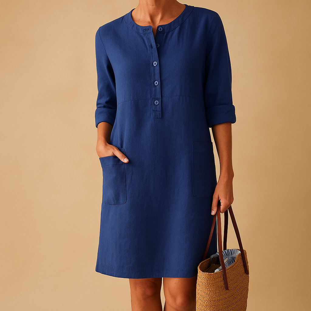 Casual dames tuniekjurk met knopen, zakken en opgerolde mouwen – ideaal voor dagelijks comfort en ontspannen stijl.