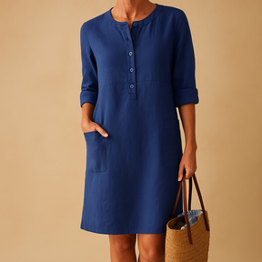 Casual dames tuniekjurk met knopen, zakken en opgerolde mouwen – ideaal voor dagelijks comfort en ontspannen stijl.