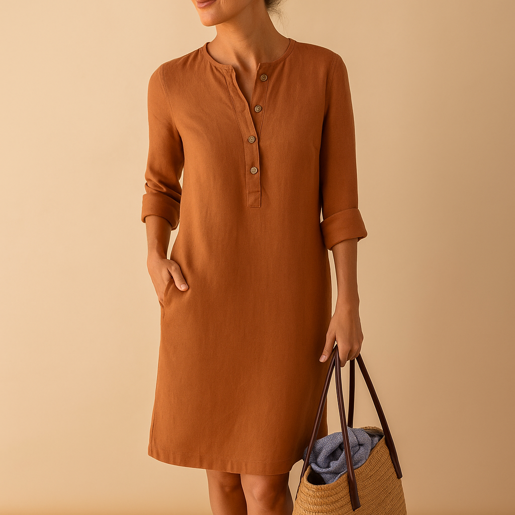 Casual dames tuniekjurk met knopen, zakken en opgerolde mouwen – ideaal voor dagelijks comfort en ontspannen stijl.