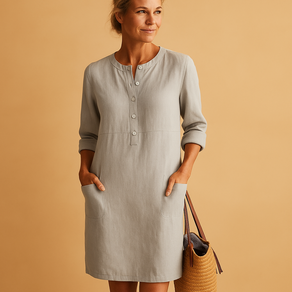 Casual dames tuniekjurk met knopen, zakken en opgerolde mouwen – ideaal voor dagelijks comfort en ontspannen stijl.
