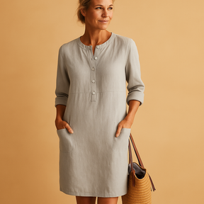 Casual dames tuniekjurk met knopen, zakken en opgerolde mouwen – ideaal voor dagelijks comfort en ontspannen stijl.