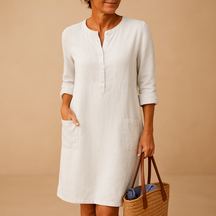 Casual dames tuniekjurk met knopen, zakken en opgerolde mouwen – ideaal voor dagelijks comfort en ontspannen stijl.