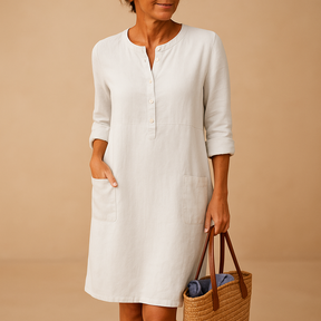 Casual dames tuniekjurk met knopen, zakken en opgerolde mouwen – ideaal voor dagelijks comfort en ontspannen stijl.