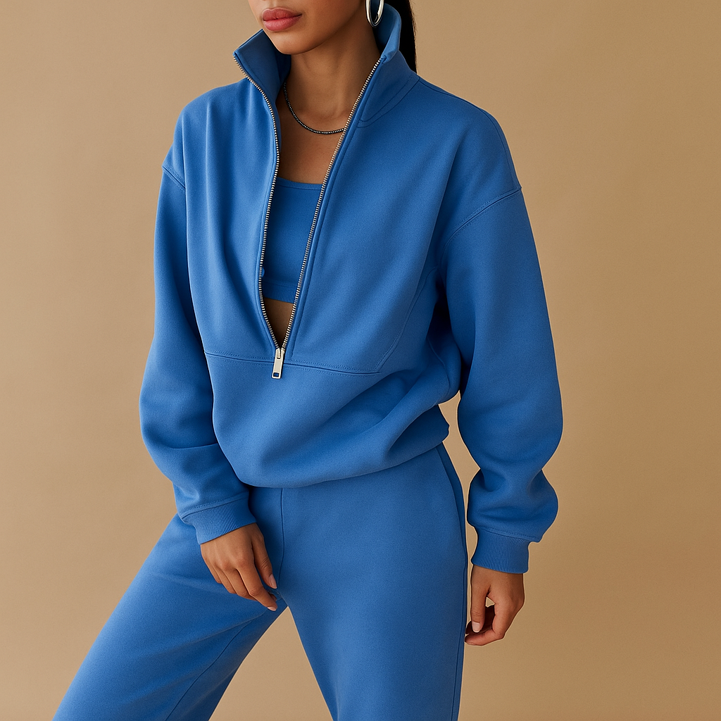Tweedelig joggingpak voor dames met vest en halve rits in roze, groen of blauw – ideaal voor loungen of sportieve dagen.