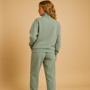 Tweedelig joggingpak voor dames met vest en halve rits in roze, groen of blauw – ideaal voor loungen of sportieve dagen.