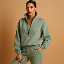 Tweedelig joggingpak voor dames met vest en halve rits in roze, groen of blauw – ideaal voor loungen of sportieve dagen.