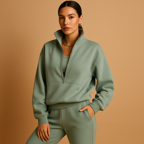 Tweedelig joggingpak voor dames met vest en halve rits in roze, groen of blauw – ideaal voor loungen of sportieve dagen.