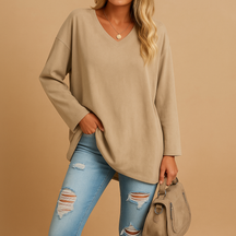 Zomerse dames top met losse pasvorm en zachte stof, ideaal voor casual en chique outfits in warme seizoenen.